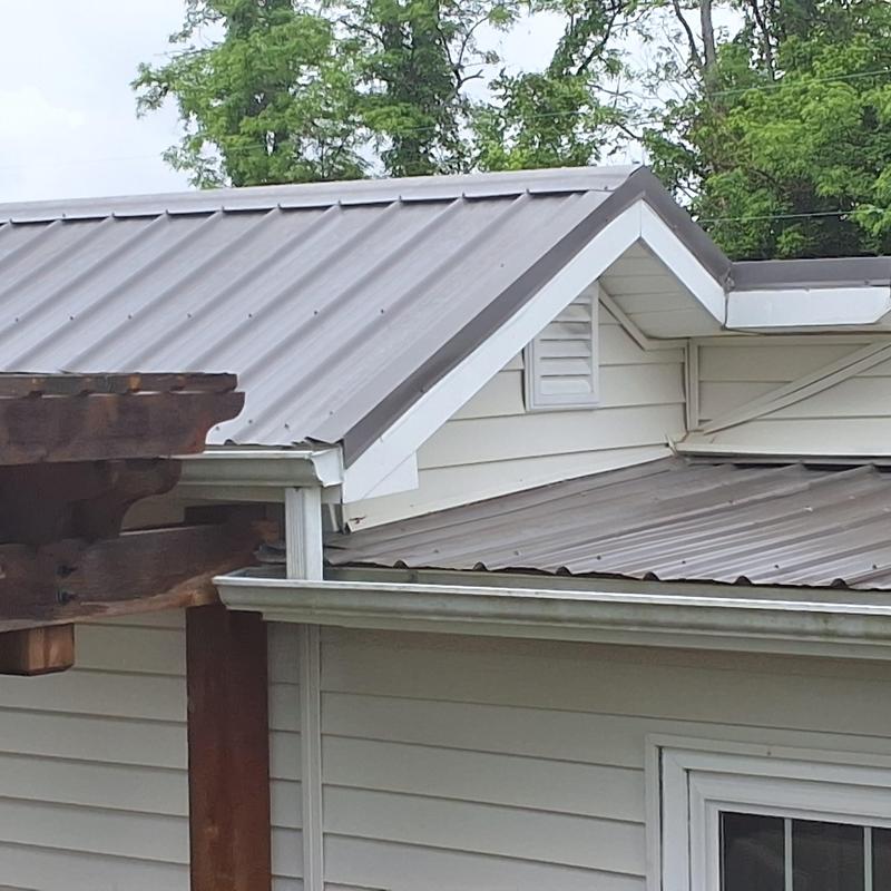 Slate gray metal roof with woodbinder screws installation Slate gray metal roof with woodbinder screws installation