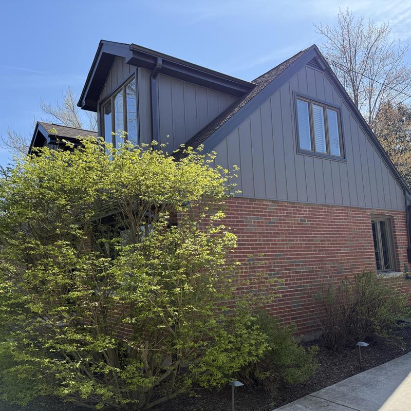 Composite siding and gutters on residential house Composite siding and gutters on residential house