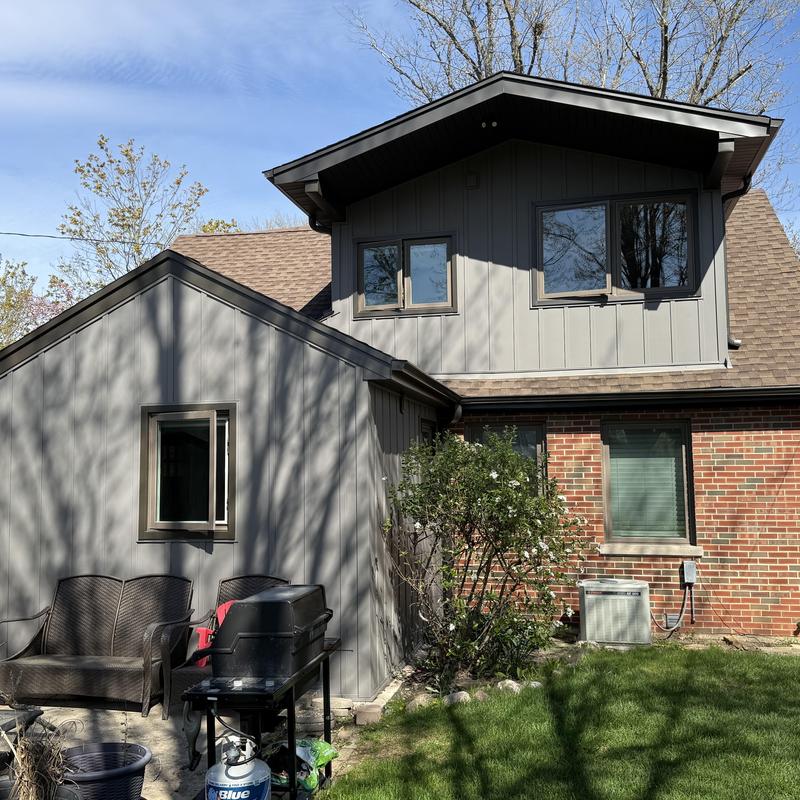 Composite siding and windows on residential house exterior Composite siding and windows on residential house exterior
