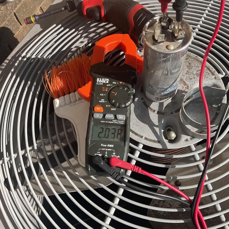 Dual run capacitor on HVAC unit with multimeter testing Dual run capacitor on HVAC unit with multimeter testing