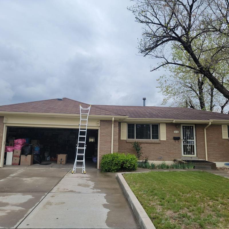 T-lock shingle roof inspection with ladder on driveway T-lock shingle roof inspection with ladder on driveway
