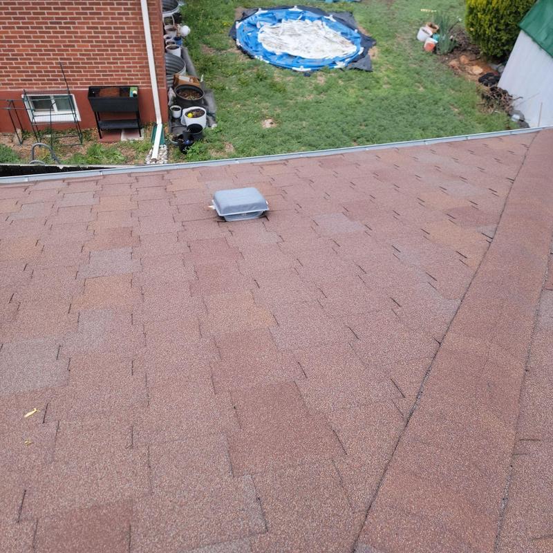 Aged T-lock shingle roof with vent and no hail damage Aged T-lock shingle roof with vent and no hail damage