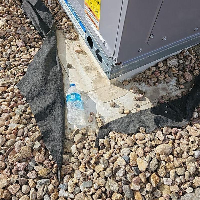 EPDM roof membrane patch around AC unit base