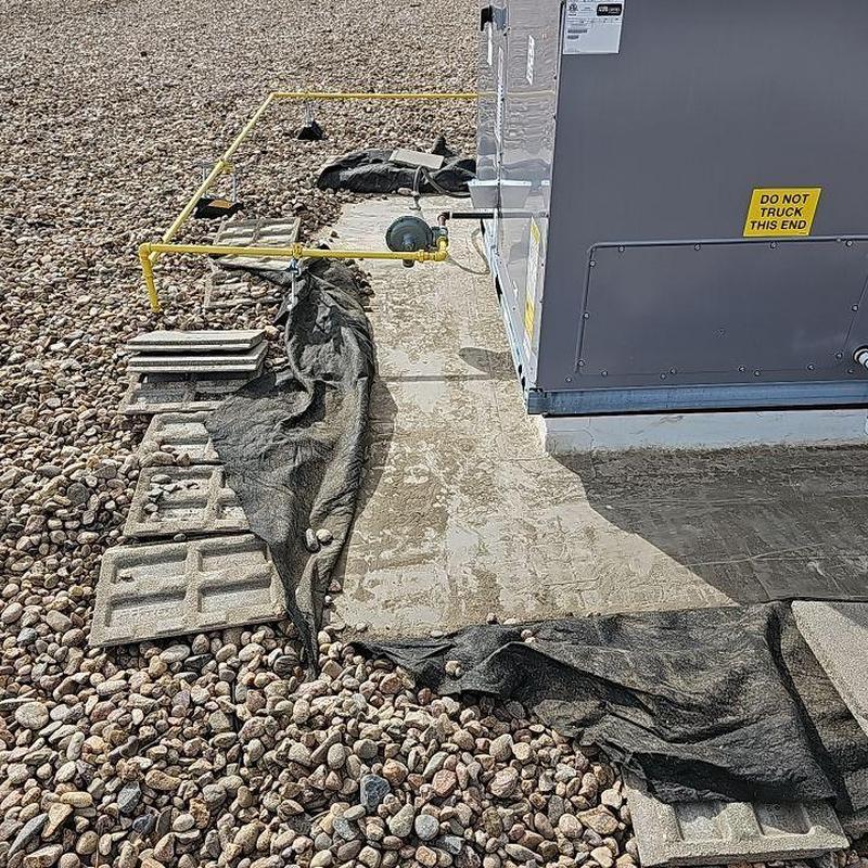 EPDM roof with AC unit and yellow gas piping