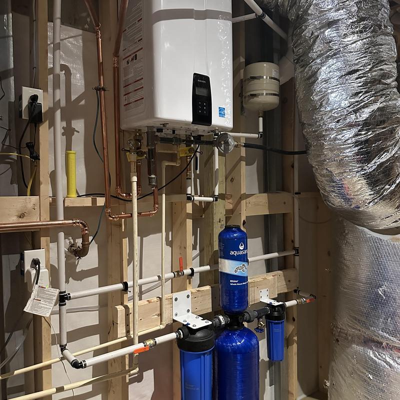 Water filtration system with tank and piping installed
