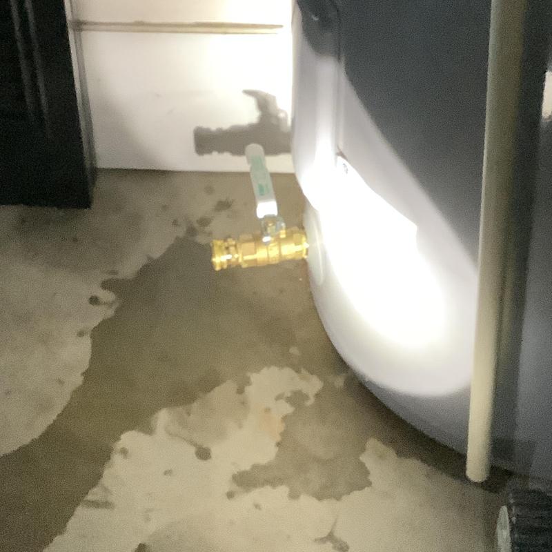 Water heater brass drain valve replacement with water spill Water heater brass drain valve replacement with water spill