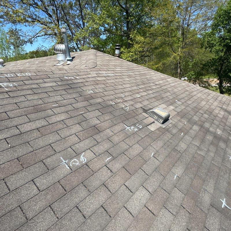 Asphalt shingle roof with white chalk inspection markings Asphalt shingle roof with white chalk inspection markings
