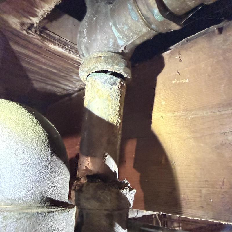 Cast iron drain pipe with severe corrosion damage