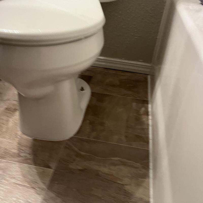Toilet with replaced supply line and reset wax ring