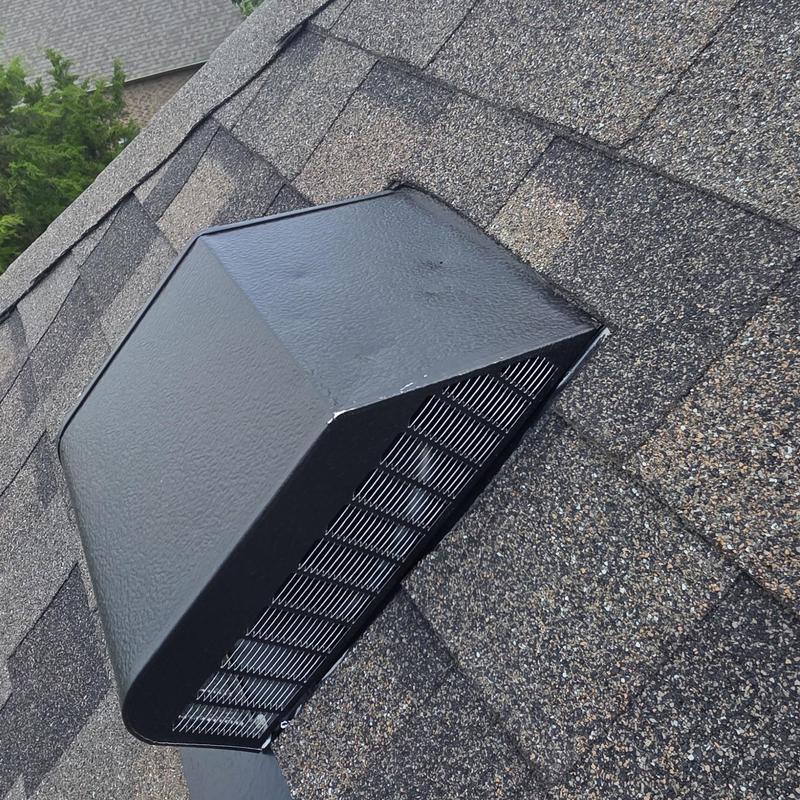 Roof vent with hail damage on asphalt shingles