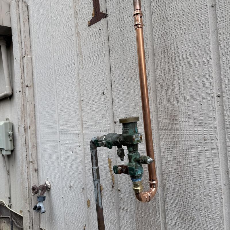Vacuum breaker line with copper pipe repair