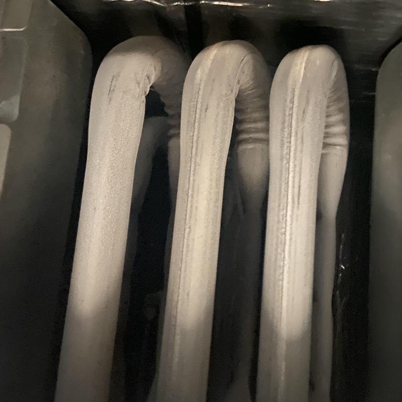 Furnace heat exchanger tubes with surface residue