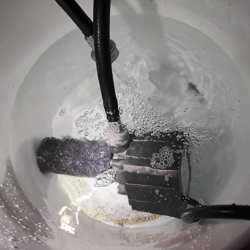 Tankless water heater flushing with sediment buildup