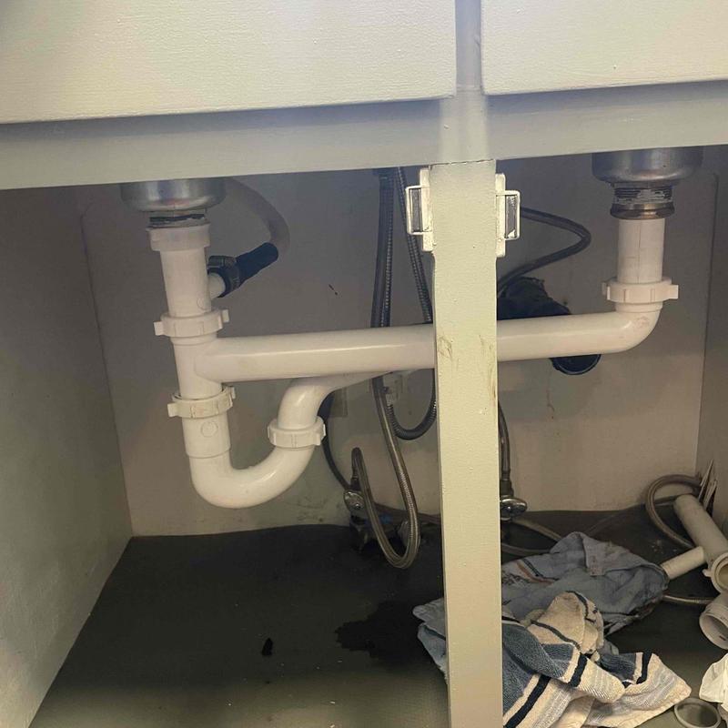 Kitchen sink double trap drainage pipes under cabinet Kitchen sink double trap drainage pipes under cabinet