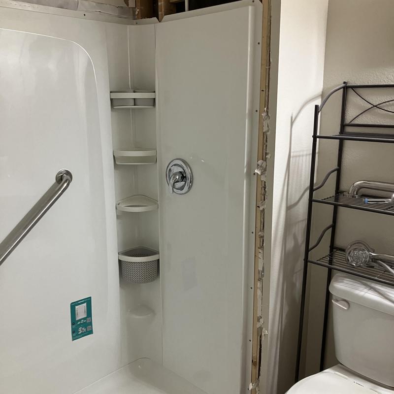 Shower surround with shelves and chrome handle installation