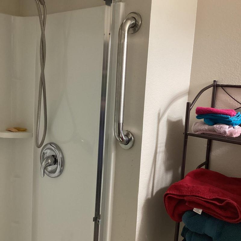 Shower pan with three-wall surround and glass door