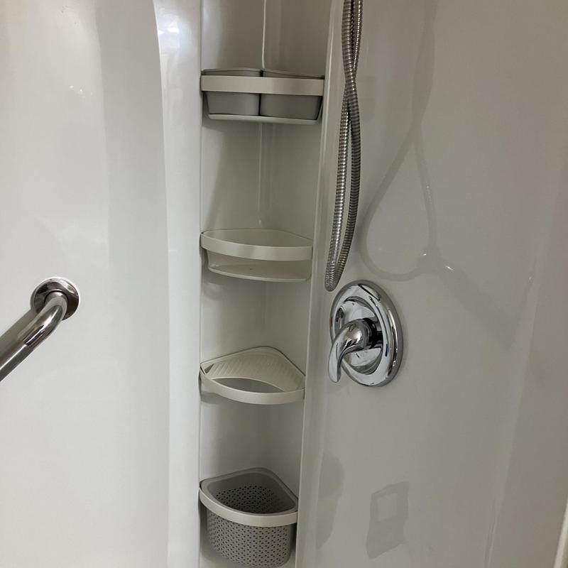 Shower wall surround with shelves and chrome handle