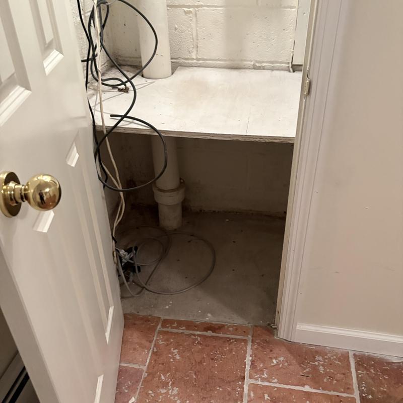 Drain pipe with wiring in utility closet area Drain pipe with wiring in utility closet area