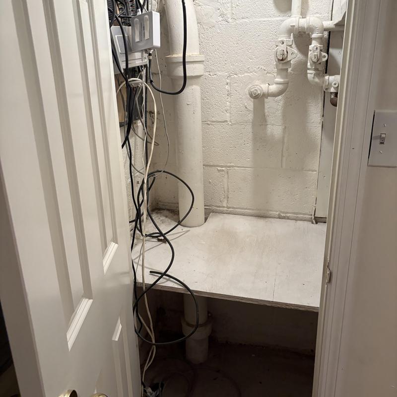 Drain pipes and electrical wiring in basement closet Drain pipes and electrical wiring in basement closet