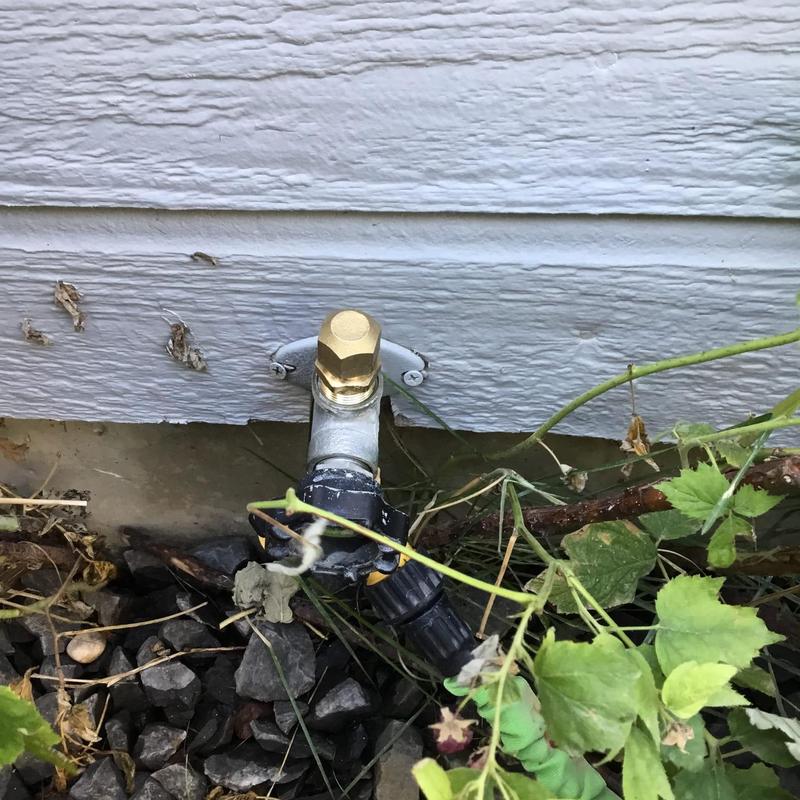 Frost free hose bib installed on building exterior Frost free hose bib installed on building exterior