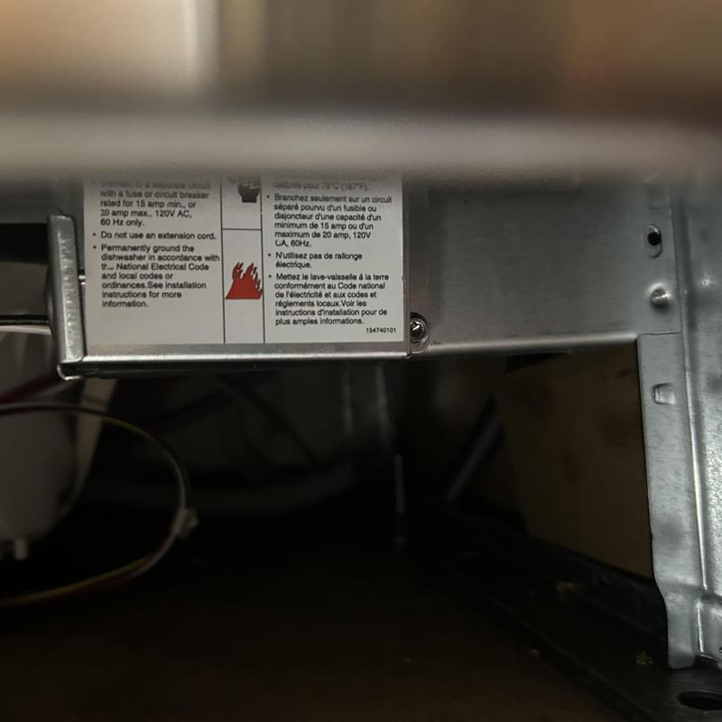 Dishwasher electrical warning label inside appliance panel