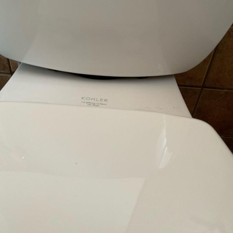 Toilet tank to bowl gasket installation detail Toilet tank to bowl gasket installation detail