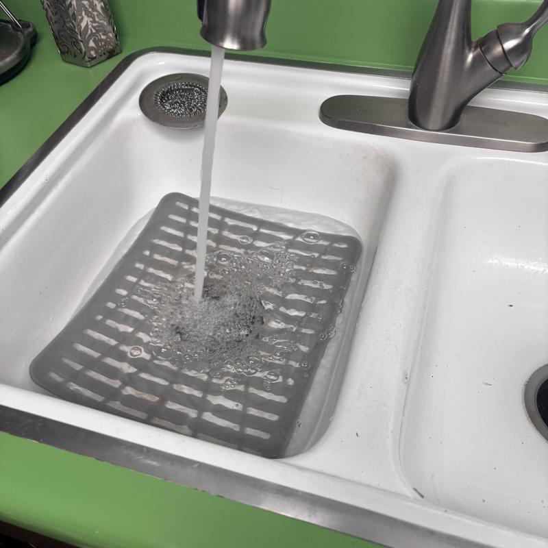 12 hp garbage disposal with running water in sink basin