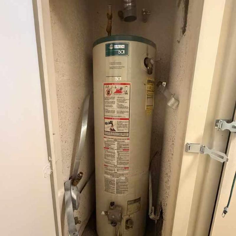 Water heater unit in narrow closet space