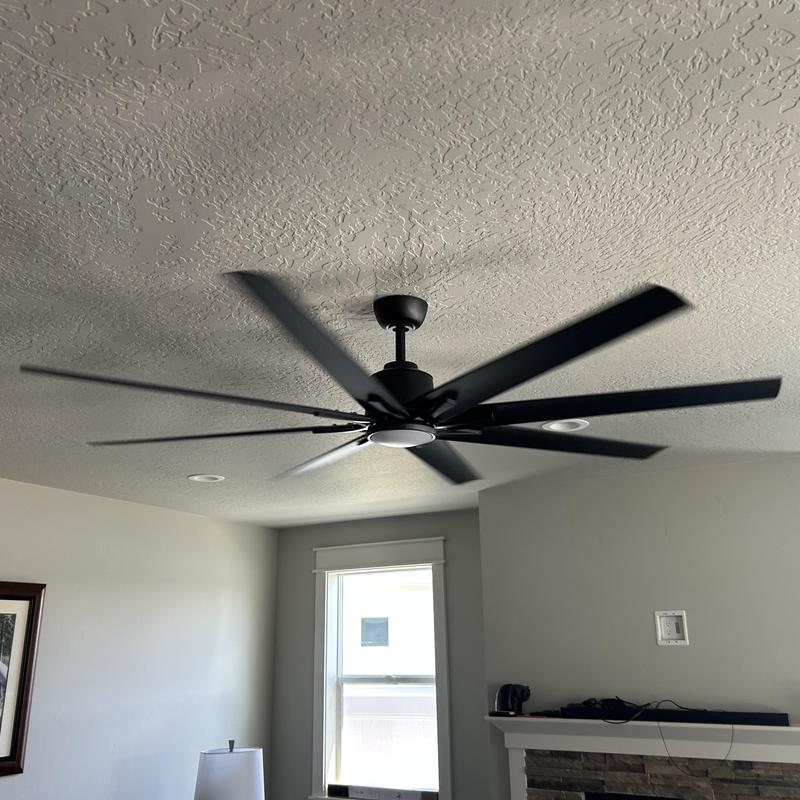 Ceiling fan installation in living room interior