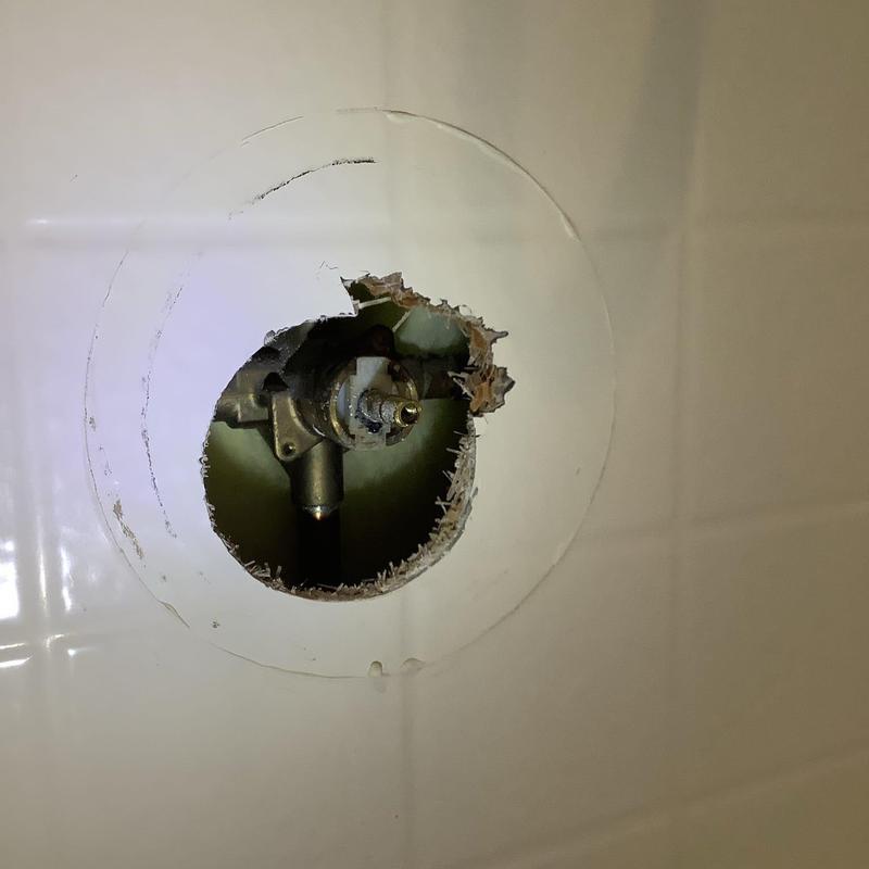 Shower valve with newly installed cartridge inside wall cavity