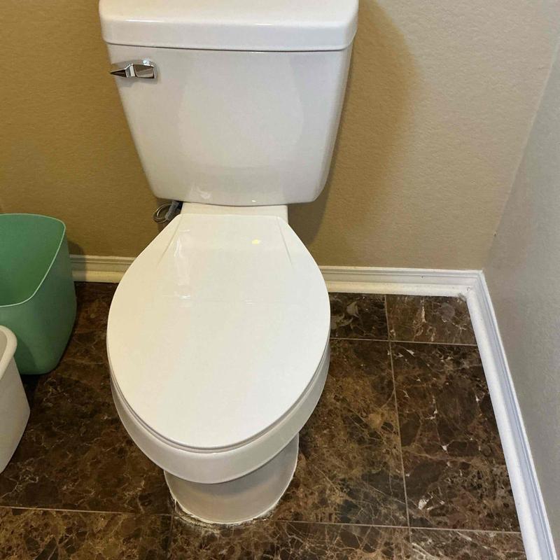 ADA elongated toilet installed in master bathroom