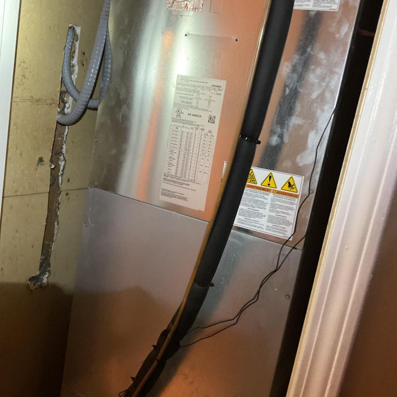 Air handler unit with refrigerant line insulation installation Air handler unit with refrigerant line insulation installation