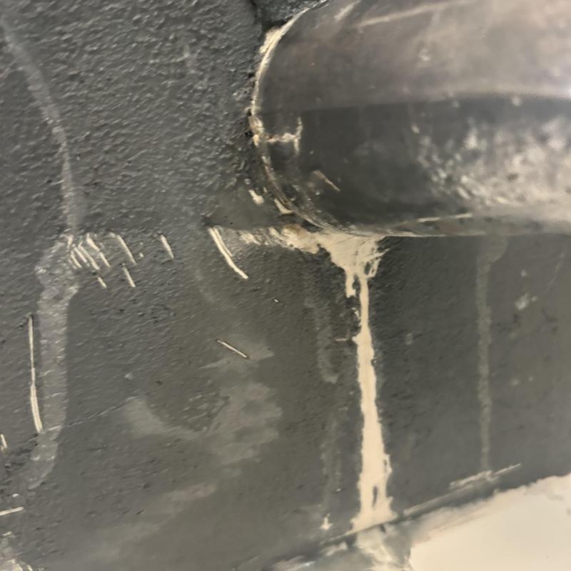 Galvanized pipe leaking behind tub spout causing damage