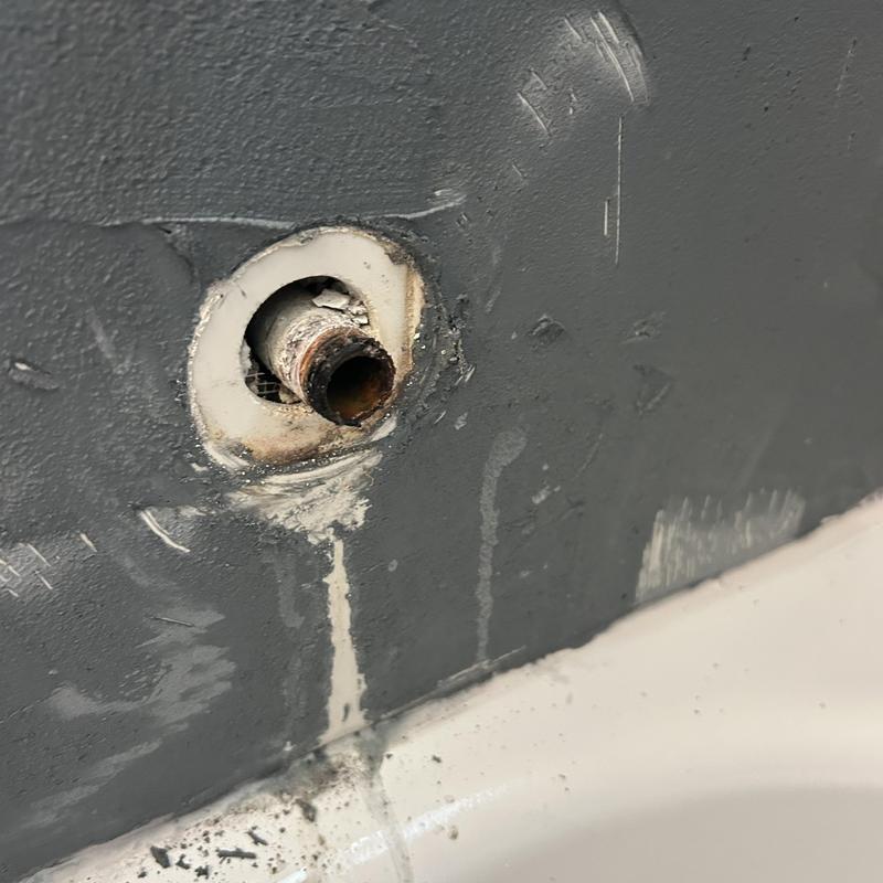Galvanized tub spout piping with corrosion damage