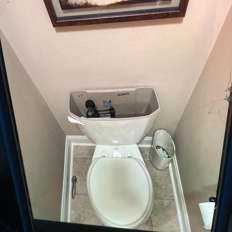 Toilet tank fill valve and flapper replacement in bathroom