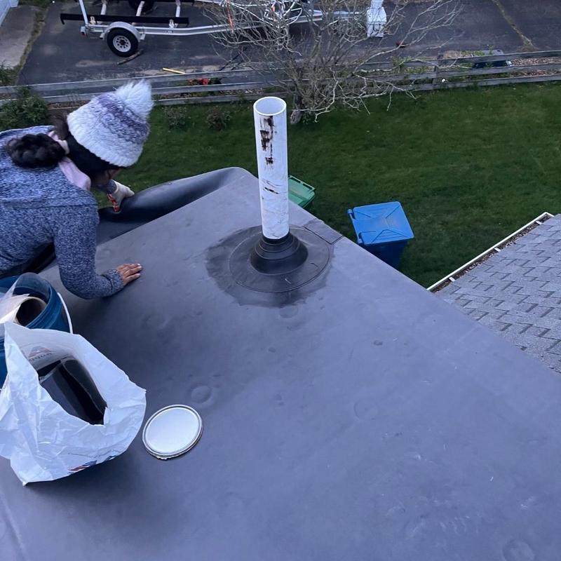 Flat roof membrane installation with plumbing vent flashing Flat roof membrane installation with plumbing vent flashing