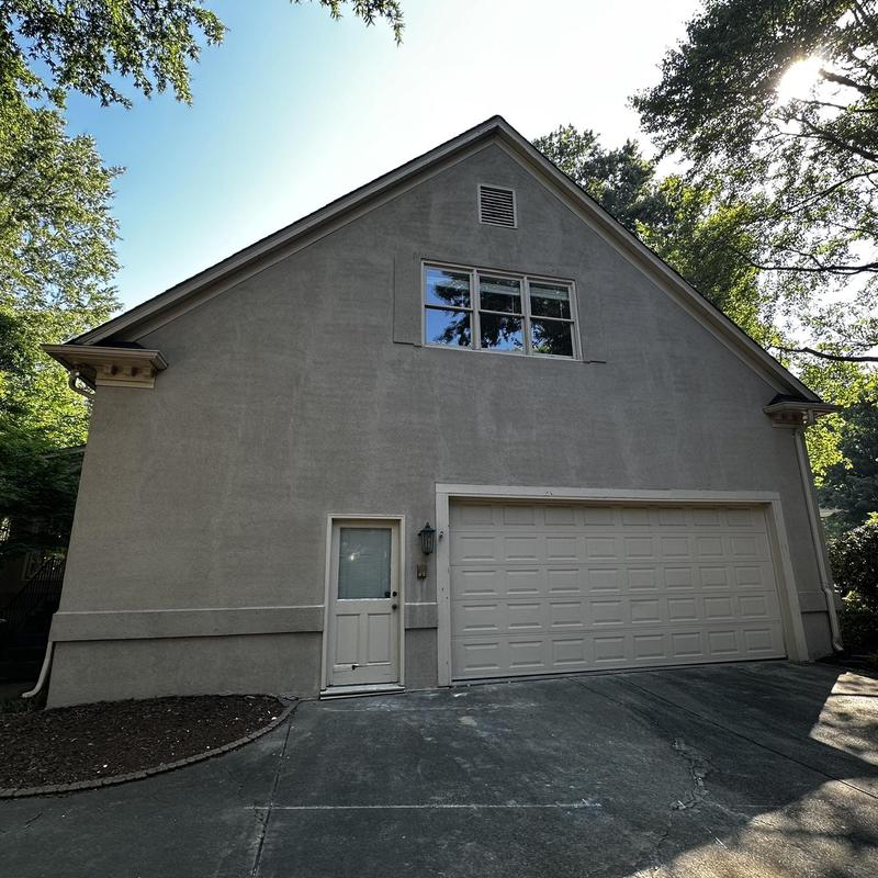 Garage door and exterior wall siding before remodel Garage door and exterior wall siding before remodel