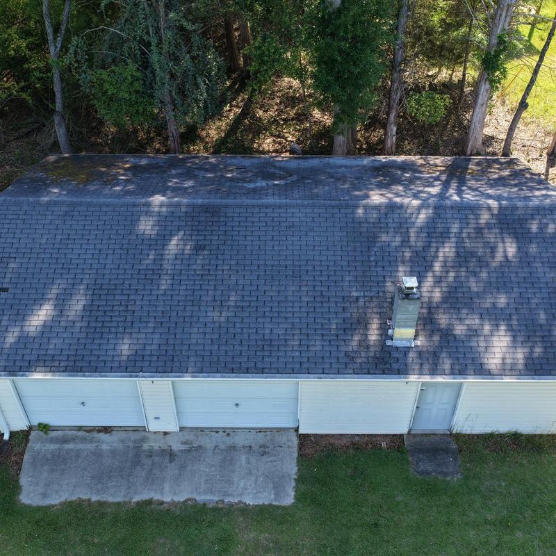 Garage roof with hail damage and chimney vent Garage roof with hail damage and chimney vent