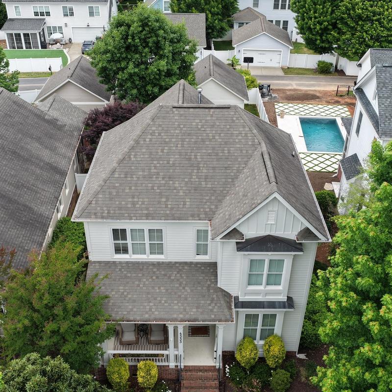 Asphalt shingle roof on suburban home from above