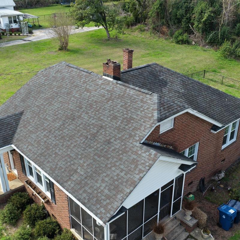 Asphalt shingle roof with brick chimneys and screened porch Asphalt shingle roof with brick chimneys and screened porch