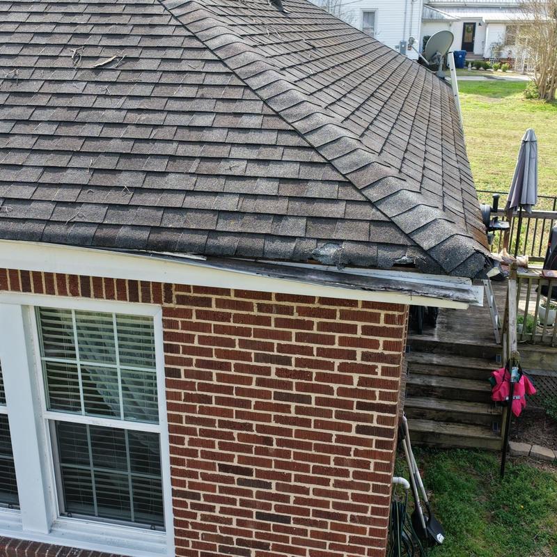 Asphalt shingle roof damage from fallen tree limb Asphalt shingle roof damage from fallen tree limb