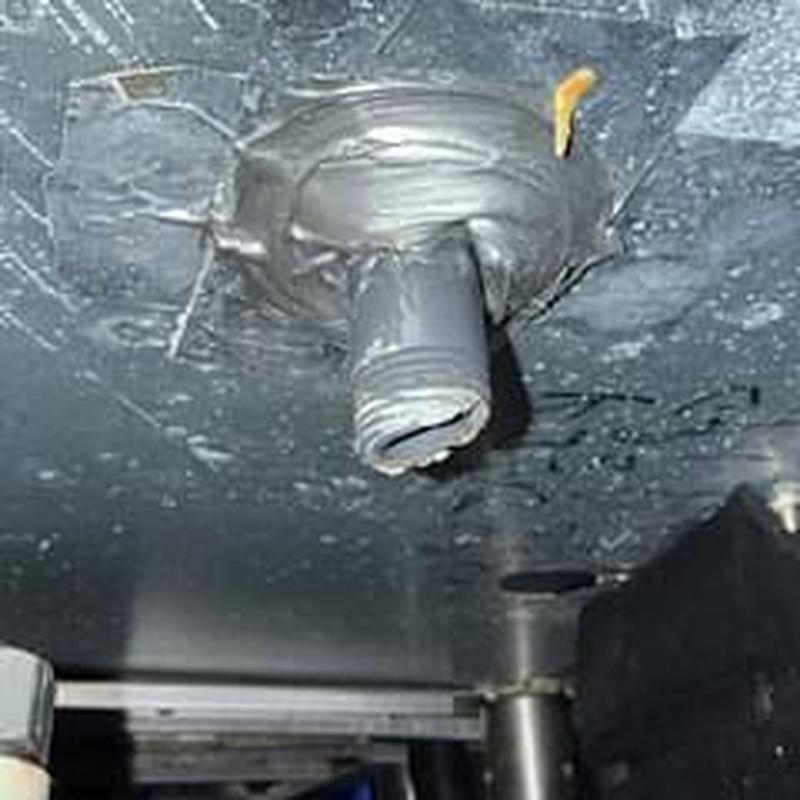 PVC pipe on ice bin with sealant applied