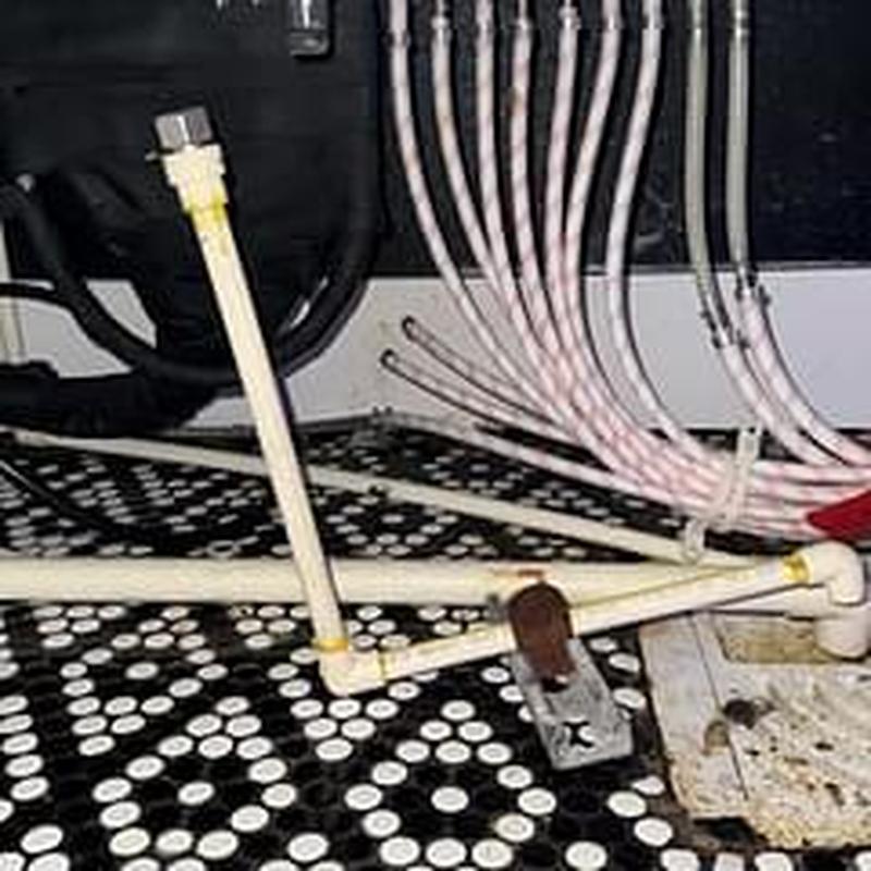 PVC pipes on ice bin with connected tubing system