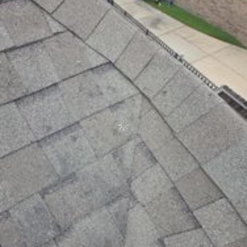 Architectural shingle roof with hail impact marks