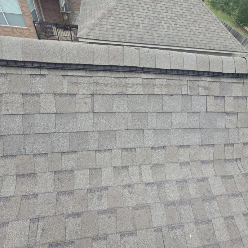 Architectural shingle roof with hail damage marks