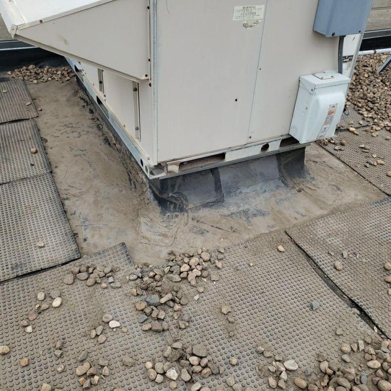 Modified bitumen roof with HVAC unit base sealant failure