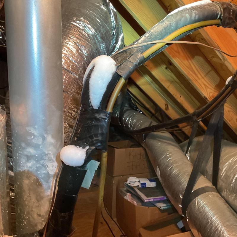 Frozen air conditioning refrigerant lines in attic system Frozen air conditioning refrigerant lines in attic system