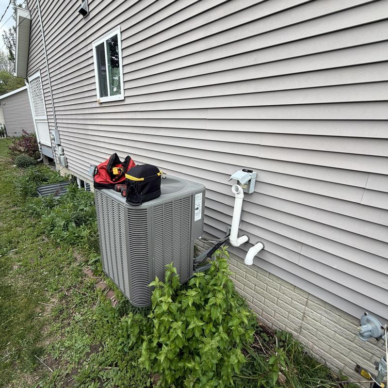 Lennox air conditioner unit with service tools outdoors Lennox air conditioner unit with service tools outdoors
