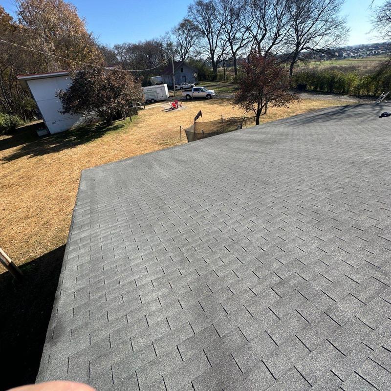 Asphalt shingle roof with hail damage inspection