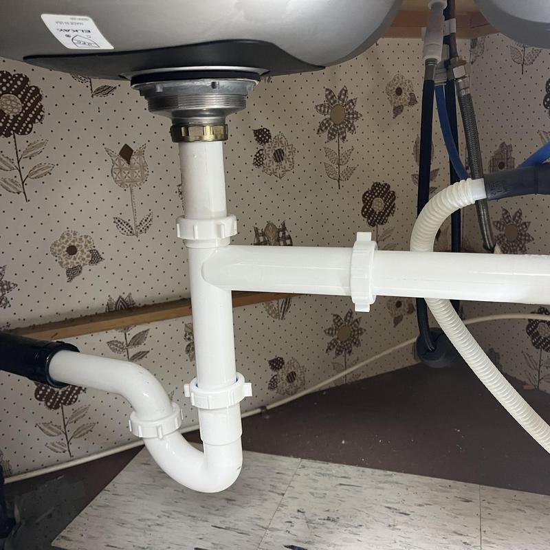 PVC drain pipe under kitchen sink installation